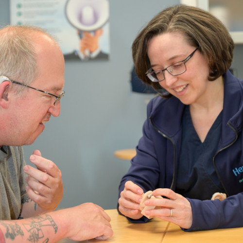 Dr. Suzanne Yoder demonstrating how the ear works with hearing aids